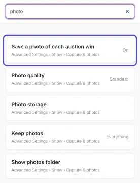 The Settings panel with photo typed in its search box and a list of matching settings, each with Advanced Settings and its page. Save a photo of each auction win is circled.